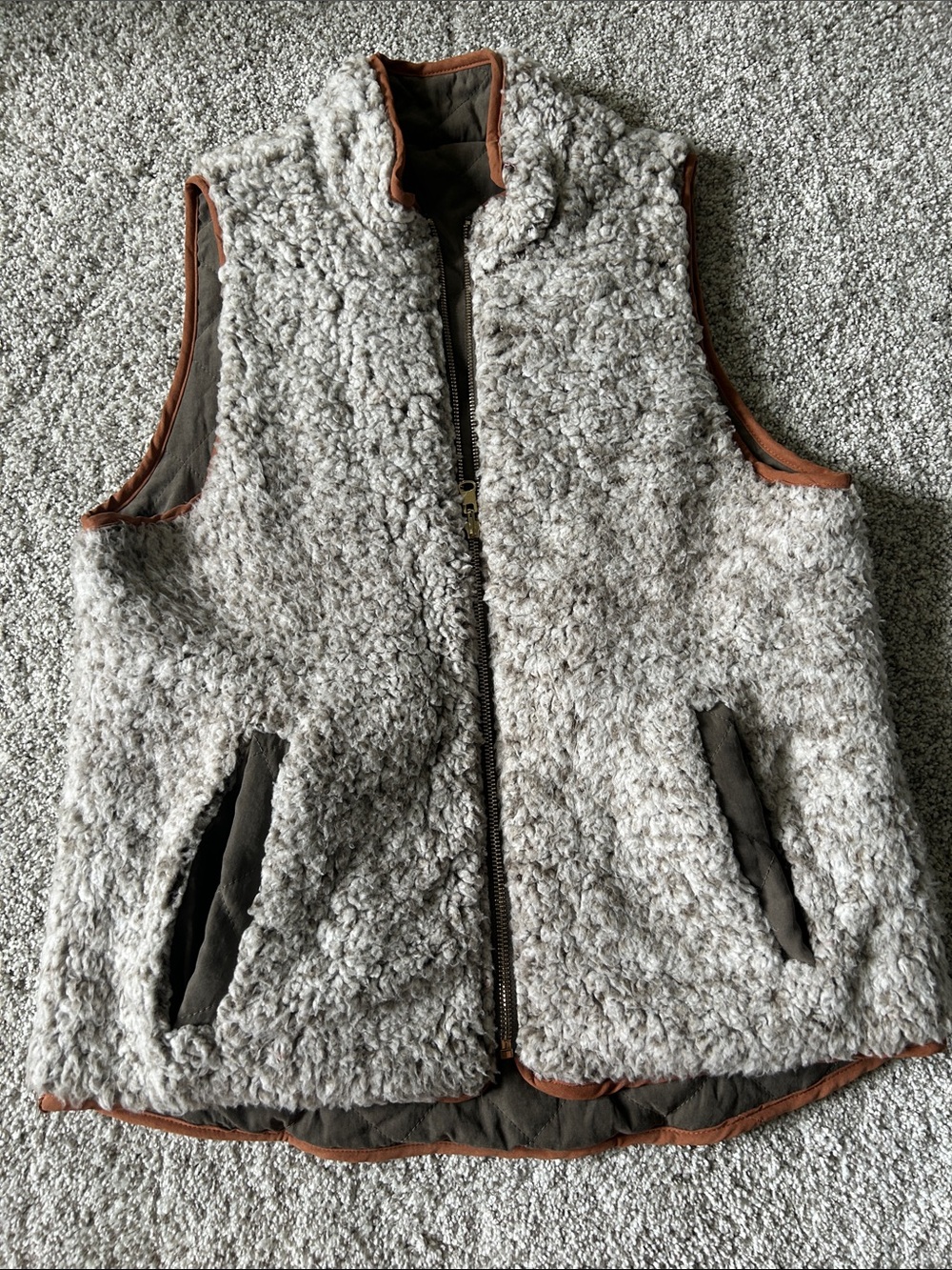 Woman’s reversible Sherpa Zip-Front Vest in Light Gray with Brown Trim